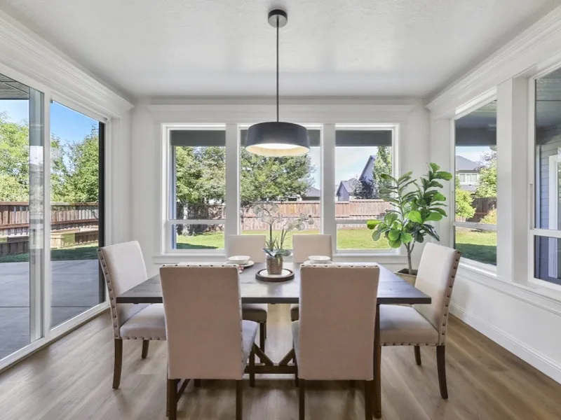 Bright remodeled dining area with wraparound windows