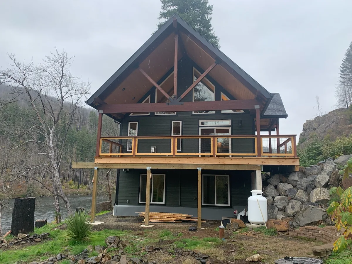 Timber home with wraparound deck built by OJEG Construction
